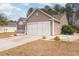 Charming one-story home featuring a two-car garage and manicured landscaping at 310 Junco Circle, Longs, SC 29568
