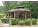 Community gazebo surrounded by lush landscaping and mature trees at 310 Junco Circle, Longs, SC 29568