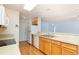 Clean kitchen featuring wood cabinets and essential appliances with a view to the living room at 310 Junco Circle, Longs, SC 29568
