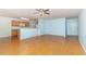 Open-concept living room with hardwood floors adjacent to the kitchen and entry at 310 Junco Circle, Longs, SC 29568