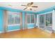 Sun-filled room with large windows, sliding glass door, and hardwood floors at 310 Junco Circle, Longs, SC 29568