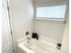 Relax in this bathtub, illuminated by natural light from the nearby window at 378 Dunbarton Ln., Conway, SC 29526