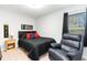 Comfortable bedroom featuring a queen-sized bed, and a cozy seating area at 378 Dunbarton Ln., Conway, SC 29526