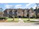A grand building with manicured front lawn and symmetrical landscaping exudes stately charm and curb appeal at 378 Dunbarton Ln., Conway, SC 29526