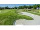 Expansive golf course view showcasing the manicured greens, sand traps, and serene pond in the neighborhood at 378 Dunbarton Ln., Conway, SC 29526