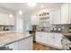 Well-lit kitchen featuring granite countertops, stainless steel appliances, and white cabinets at 378 Dunbarton Ln., Conway, SC 29526