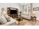 Comfortable living area featuring a large entertainment center and two plush sofas on rug at 378 Dunbarton Ln., Conway, SC 29526