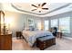 This main bedroom offers a trey ceiling, ceiling fan, and large windows for plenty of natural light at 378 Dunbarton Ln., Conway, SC 29526