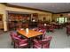 Elegant restaurant boasts a dark wood bar, tables and comfortable seating for residents and their guests at 378 Dunbarton Ln., Conway, SC 29526