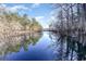 Scenic water view showcasing serene lake with sky reflection and lush trees lining the shoreline at 378 Dunbarton Ln., Conway, SC 29526