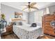 Bright bedroom featuring hardwood floors and a ceiling fan, creating a warm and inviting ambiance at 380 Myrtle Greens Dr. # E, Conway, SC 29526