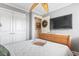 Neutral bedroom features a ceiling fan, large closet, and a wall-mounted TV at 380 Myrtle Greens Dr. # E, Conway, SC 29526