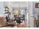 Charming dining room featuring a chandelier, round table with seating for four, and plenty of natural light at 380 Myrtle Greens Dr. # E, Conway, SC 29526