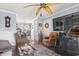 Comfortable living room and dining room featuring stylish furnishings, hardwood floors, and lots of decor at 380 Myrtle Greens Dr. # E, Conway, SC 29526