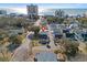 Aerial view of a quaint neighborhood with a beach and high-rise buildings in the background at 3901-B Birchwood St., North Myrtle Beach, SC 29582