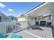 Relaxing outdoor balcony area with comfortable seating, perfect for enjoying the weather at 3901-B Birchwood St., North Myrtle Beach, SC 29582