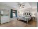 Comfortable bedroom with a queen-sized bed, soft lighting, and beach-themed decor at 3901-B Birchwood St., North Myrtle Beach, SC 29582