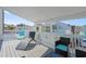 Relaxing deck area offering lounge chairs, beautiful views, and comfortable seating with bright accents at 3901-B Birchwood St., North Myrtle Beach, SC 29582