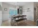 Charming dining area with sliding door to the patio and decorative paddles at 3901-B Birchwood St., North Myrtle Beach, SC 29582