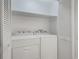 A laundry room features a washer, a dryer, and white folding door at 3901-B Birchwood St., North Myrtle Beach, SC 29582