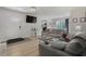 Inviting living room with contemporary furnishings, a TV, and an open view to the kitchen and dining area at 3901-B Birchwood St., North Myrtle Beach, SC 29582