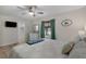 Calm bedroom featuring ceiling fan, a comfortable bed and a large window at 3901-B Birchwood St., North Myrtle Beach, SC 29582