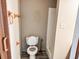 Bathroom featuring a toilet, towel rack, and shower at 422 S Magnolia Ave., Andrews, SC 29510