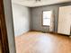 Bedroom featuring grey walls, light floors, and a window at 422 S Magnolia Ave., Andrews, SC 29510