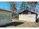 Angle view of the exterior of the property with 2 detached garages in the backyard at 422 S Magnolia Ave., Andrews, SC 29510
