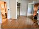 Hallway with light wood floors leading to bathroom at 422 S Magnolia Ave., Andrews, SC 29510
