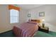 Bedroom features a cozy quilt and a bedside table with a lamp at 4257 Villas Dr. # 106, Little River, SC 29566