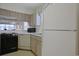 A functional kitchen includes appliances and light wood cabinetry at 4257 Villas Dr. # 106, Little River, SC 29566