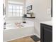 Relaxing bathroom with a soaking tub, modern fixtures, and minimalist decor at 4448 Lady Banks Ln. # 11E, Murrells Inlet, SC 29576