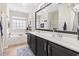 Bright and spacious bathroom featuring double sinks, a soaking tub, and a glass-enclosed shower at 4448 Lady Banks Ln. # 11E, Murrells Inlet, SC 29576