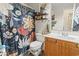 Bathroom showcasing vanity, toilet, and a shower with decorative curtain at 4448 Lady Banks Ln. # 11E, Murrells Inlet, SC 29576
