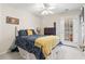 Cozy bedroom features a ceiling fan, comfortable bed, and private outdoor access at 4448 Lady Banks Ln. # 11E, Murrells Inlet, SC 29576