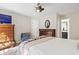 Bright bedroom featuring hardwood floors, dresser and access to ensuite bathroom at 4448 Lady Banks Ln. # 11E, Murrells Inlet, SC 29576