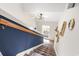 Bright foyer features modern light fixture, stairs with runner, and stylish decor at 4448 Lady Banks Ln. # 11E, Murrells Inlet, SC 29576