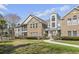 Exterior view of building featuring brick accents and mature trees at 4448 Lady Banks Ln. # 11E, Murrells Inlet, SC 29576