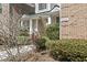 Charming home exterior featuring a cozy columned entrance and well-maintained landscaping at 4448 Lady Banks Ln. # 11E, Murrells Inlet, SC 29576