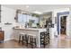 Well-lit kitchen featuring quartz countertops, bar seating, and wine rack at 4448 Lady Banks Ln. # 11E, Murrells Inlet, SC 29576