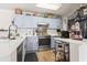 Cozy kitchen featuring updated appliances, plenty of storage, and stylish decor at 4448 Lady Banks Ln. # 11E, Murrells Inlet, SC 29576