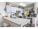 Bright kitchen featuring light blue cabinets, white countertops and stainless steel appliances at 4448 Lady Banks Ln. # 11E, Murrells Inlet, SC 29576