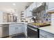 Well-appointed kitchen featuring mosaic backsplash and modern appliances at 4448 Lady Banks Ln. # 11E, Murrells Inlet, SC 29576