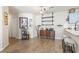 Open-concept living room with wood floors, a bar area, and stylish décor at 4448 Lady Banks Ln. # 11E, Murrells Inlet, SC 29576