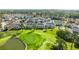 An aerial view shows the neighborhood bordering a lush golf course and a tranquil pond at 4701 Wild Iris Dr. # 16-204, Myrtle Beach, SC 29577