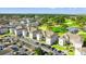 Aerial view of the community with golf course, water feature, condo buildings, and ample parking at 4701 Wild Iris Dr. # 16-204, Myrtle Beach, SC 29577