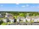 Aerial view of the community with golf course, water feature, condo buildings, and ample parking at 4701 Wild Iris Dr. # 16-204, Myrtle Beach, SC 29577
