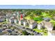 Aerial view highlighting a condo building within a community with golf course and green landscaping at 4701 Wild Iris Dr. # 16-204, Myrtle Beach, SC 29577