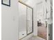 Bathroom featuring a shower with sliding glass doors and a view into the main bedroom at 4701 Wild Iris Dr. # 16-204, Myrtle Beach, SC 29577